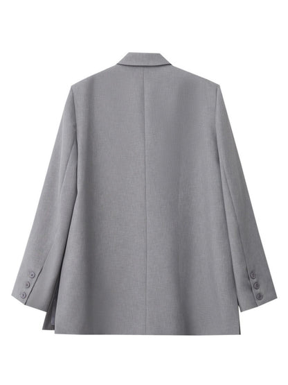 Produktbillede af grå blazer, frontvisning.